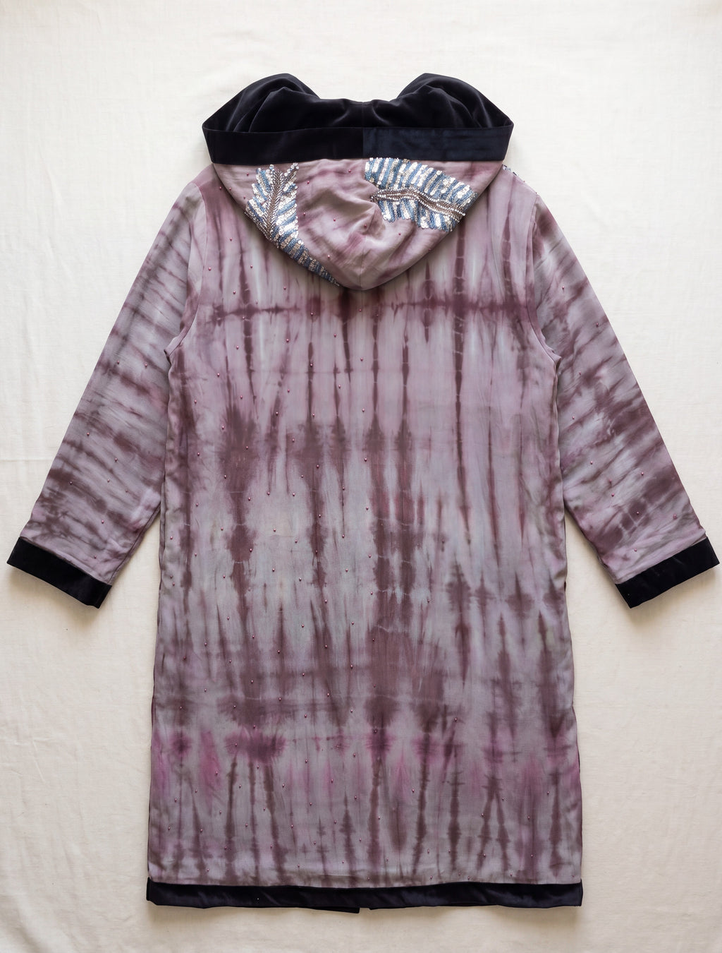 Flatlay Backside The Ritual long coat purple tie and dye with feather embroidery unique piece of garment