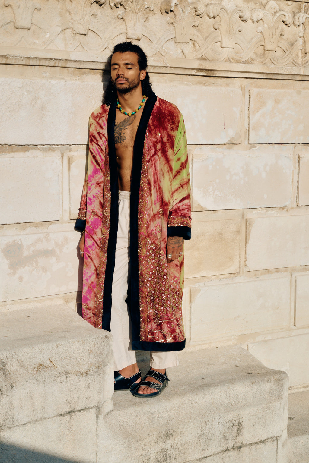 Male model wearing the model The Ceremonial M/L long silk coat made of natural silk and handmade embroidery 