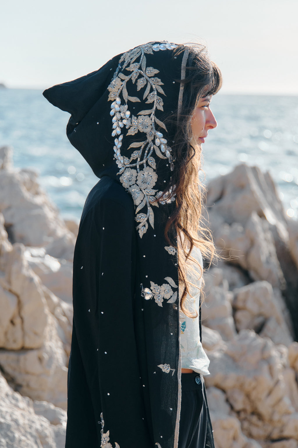 One-of-a-kind black silk hooded jacket with hand embroidery, upcycled from a vintage Indian sari — sustainable fashion by Yayavara Creation