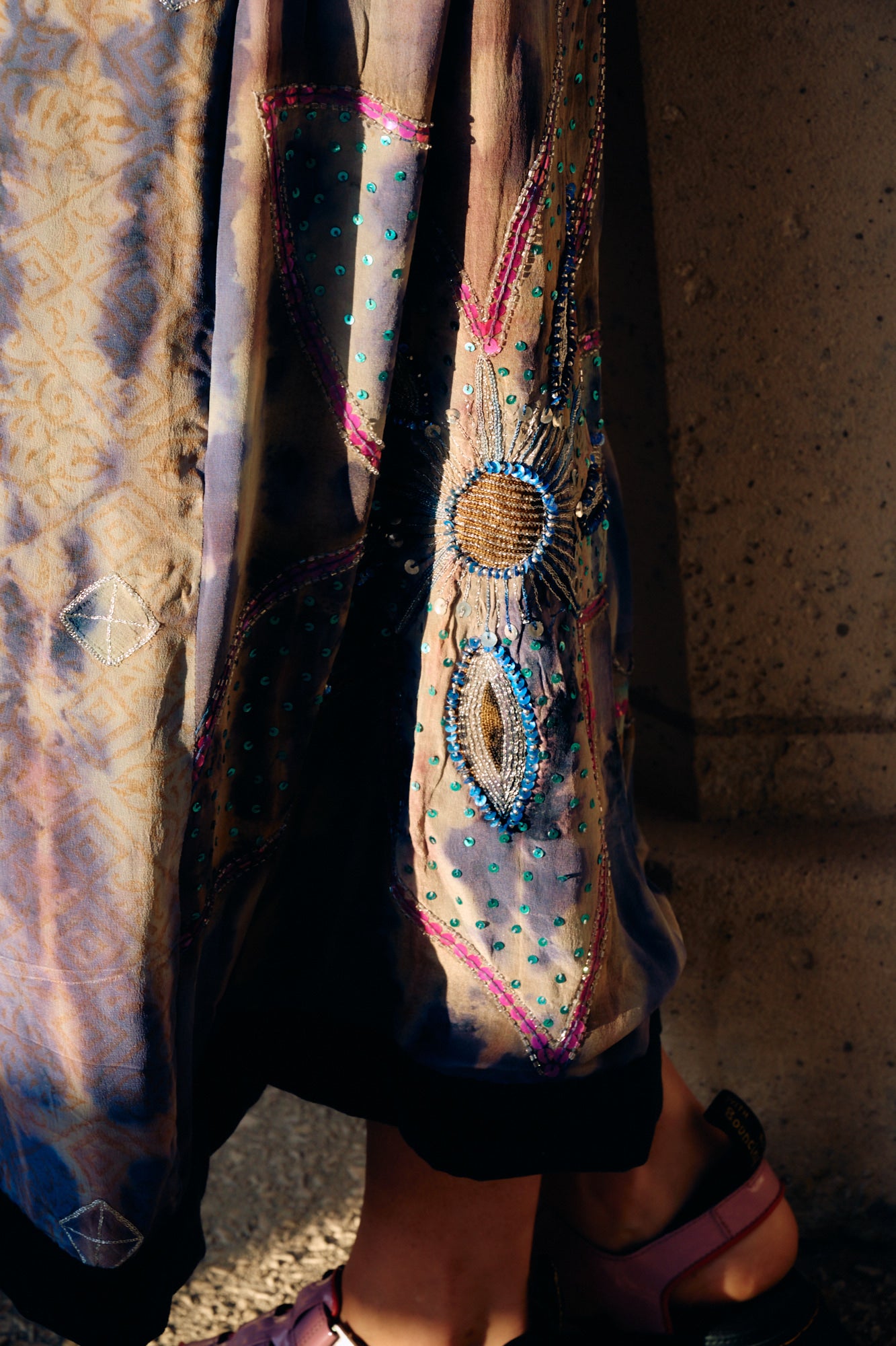 Zoom on the handmade embroidery of The Ceremonial long silk coat unique piece of garment by Yayavara Creation
